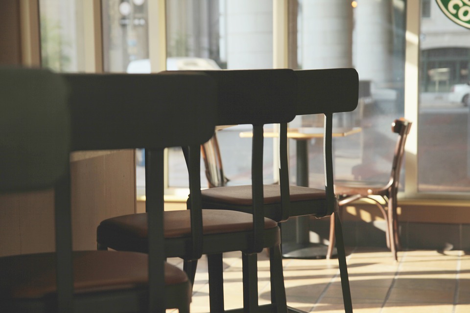 Wooden cafe chairs in a row