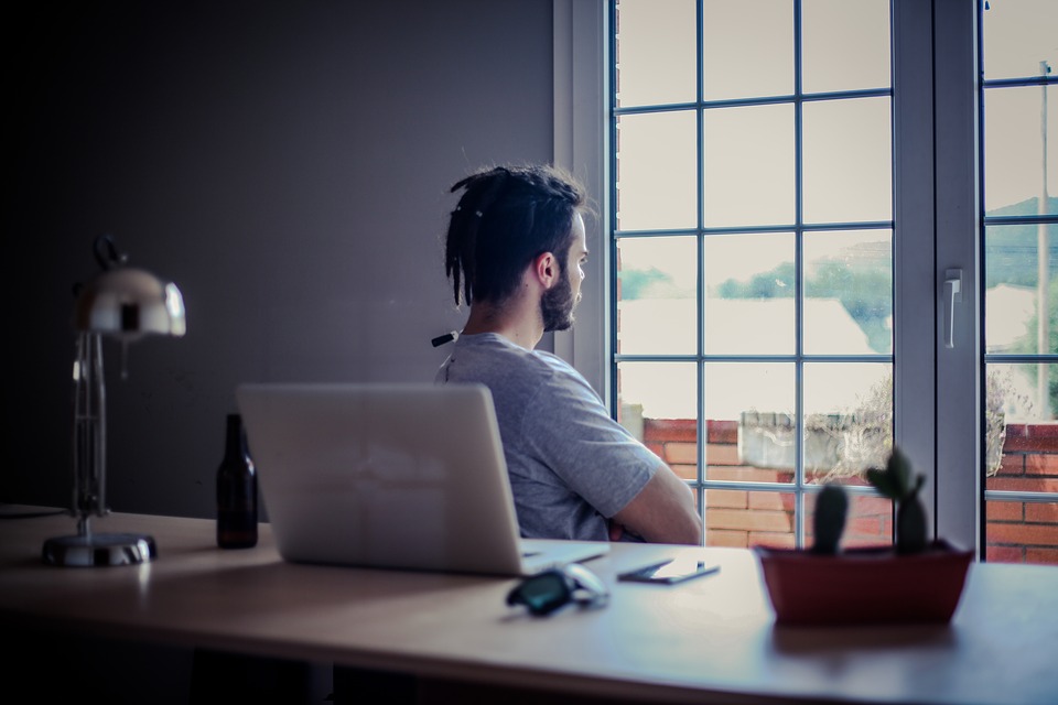 Man gazing out of a window